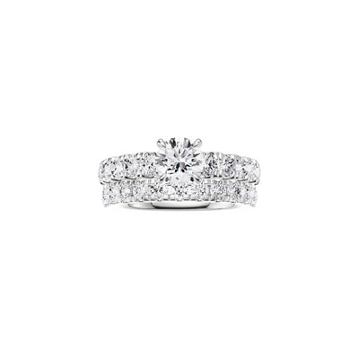 18ct EF VS laboratory grown diamond u claw setting ring with a round brilliant diamond in a classic claw setting and a matching wedding band