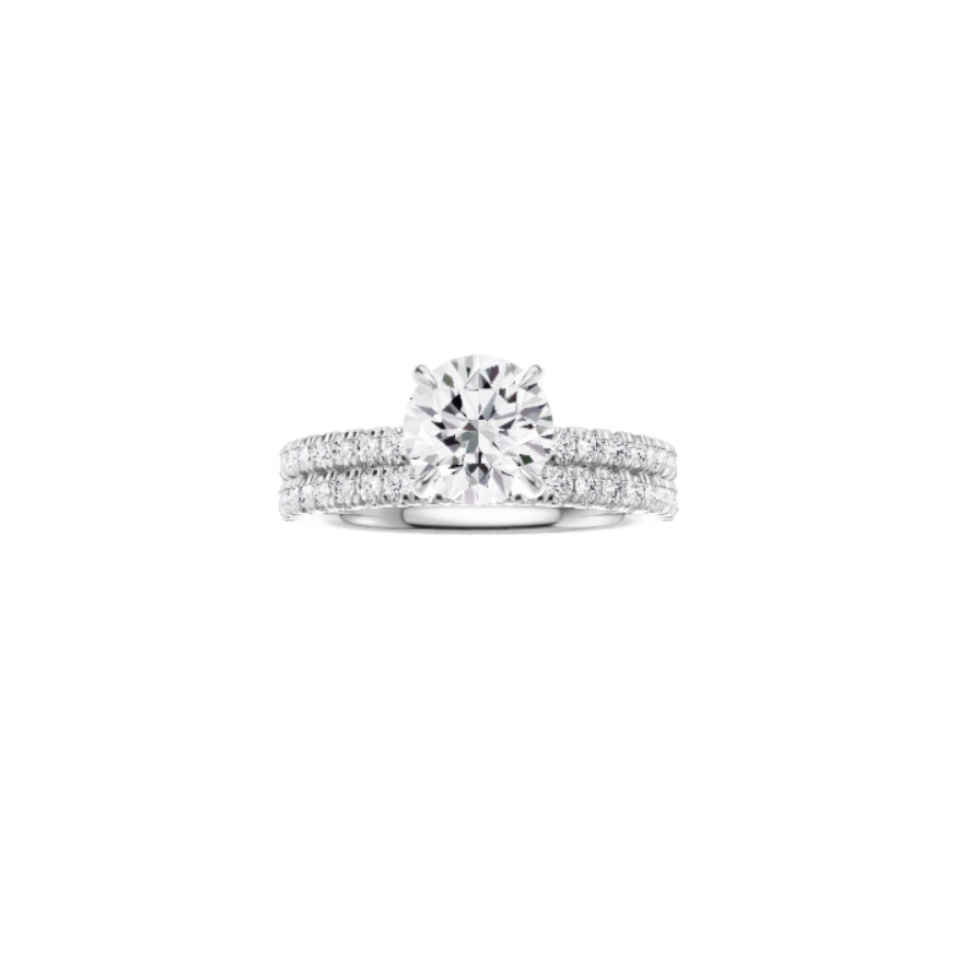 18ct EF VS laboratory grown diamond french pave ring with a round brilliant diamond in a hidden halo setting and a matching wedding band