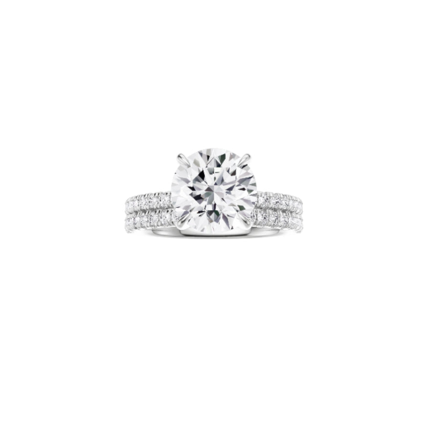 18ct EF VS laboratory grown diamond french pave ring with a round brilliant diamond in a hidden halo setting and a matching wedding band