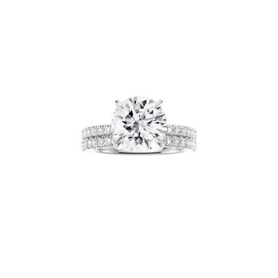 18ct EF VS laboratory grown diamond french pave ring with a round brilliant diamond in a hidden halo setting and a matching wedding band