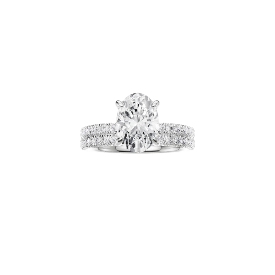 PT EF VS laboratory grown diamond french pave ring with a oval cut diamond in a classic claw setting and a matching wedding band