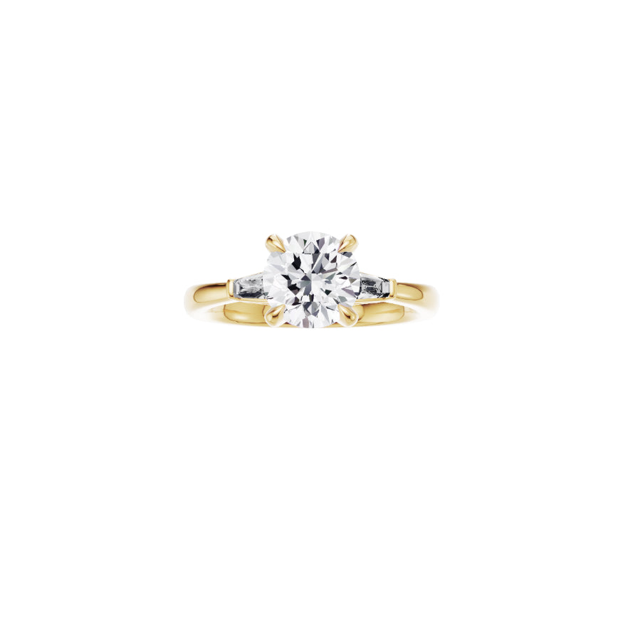 18ct EF VS laboratory grown diamond side baguette ring with a round brilliant diamond in a classic claw setting