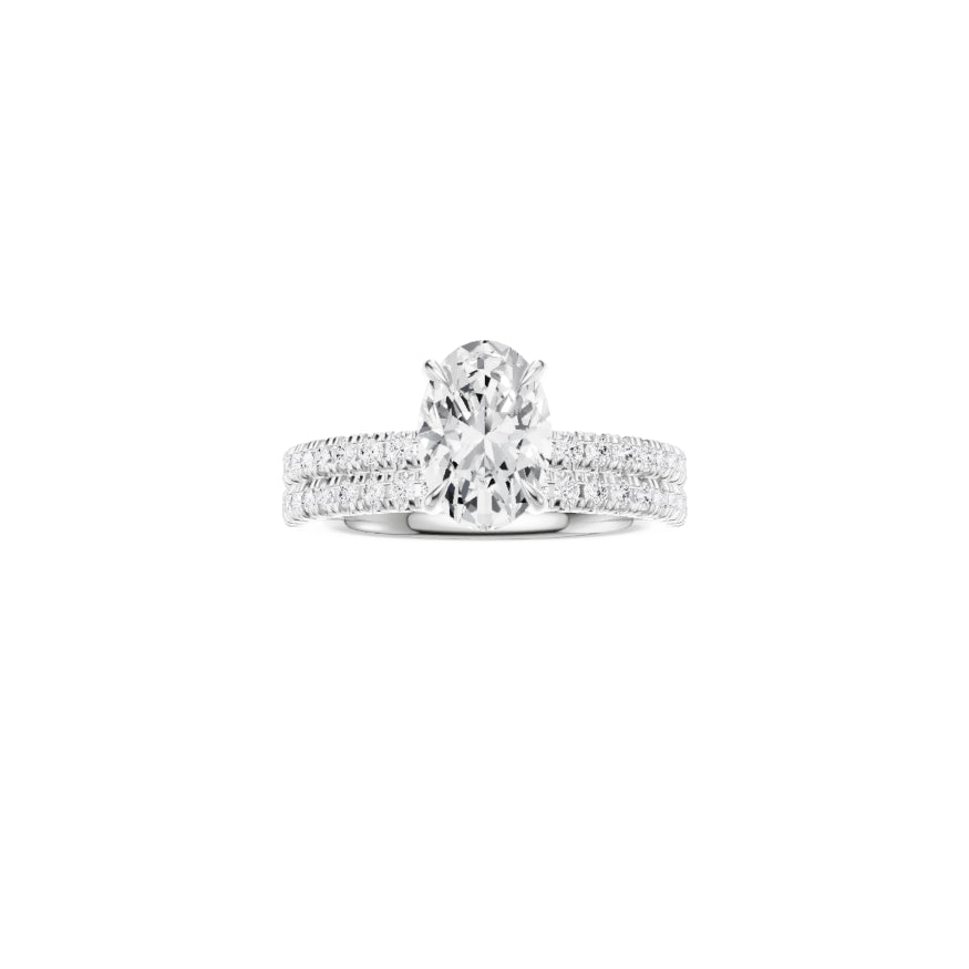 Platinum EF VS laboratory grown diamond french pave ring with a oval cut diamond in a hidden halo setting and a matching wedding band