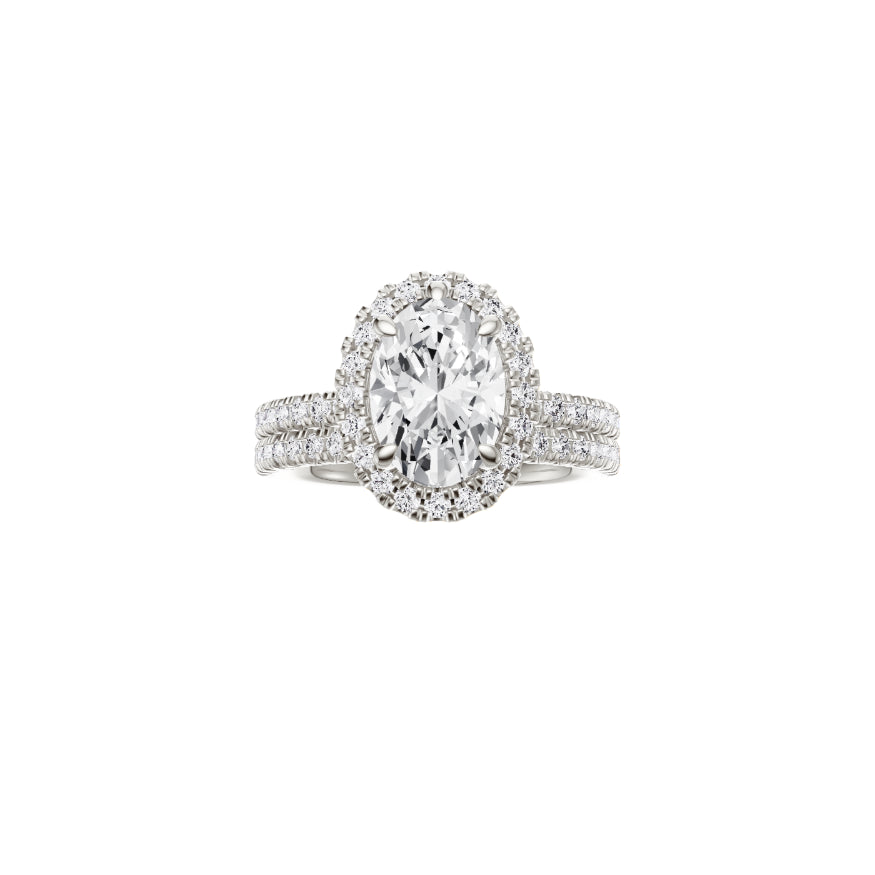 18ct EF VS laboratory grown diamond french pave ring with a oval cut diamond in a single halo setting and a matching wedding band